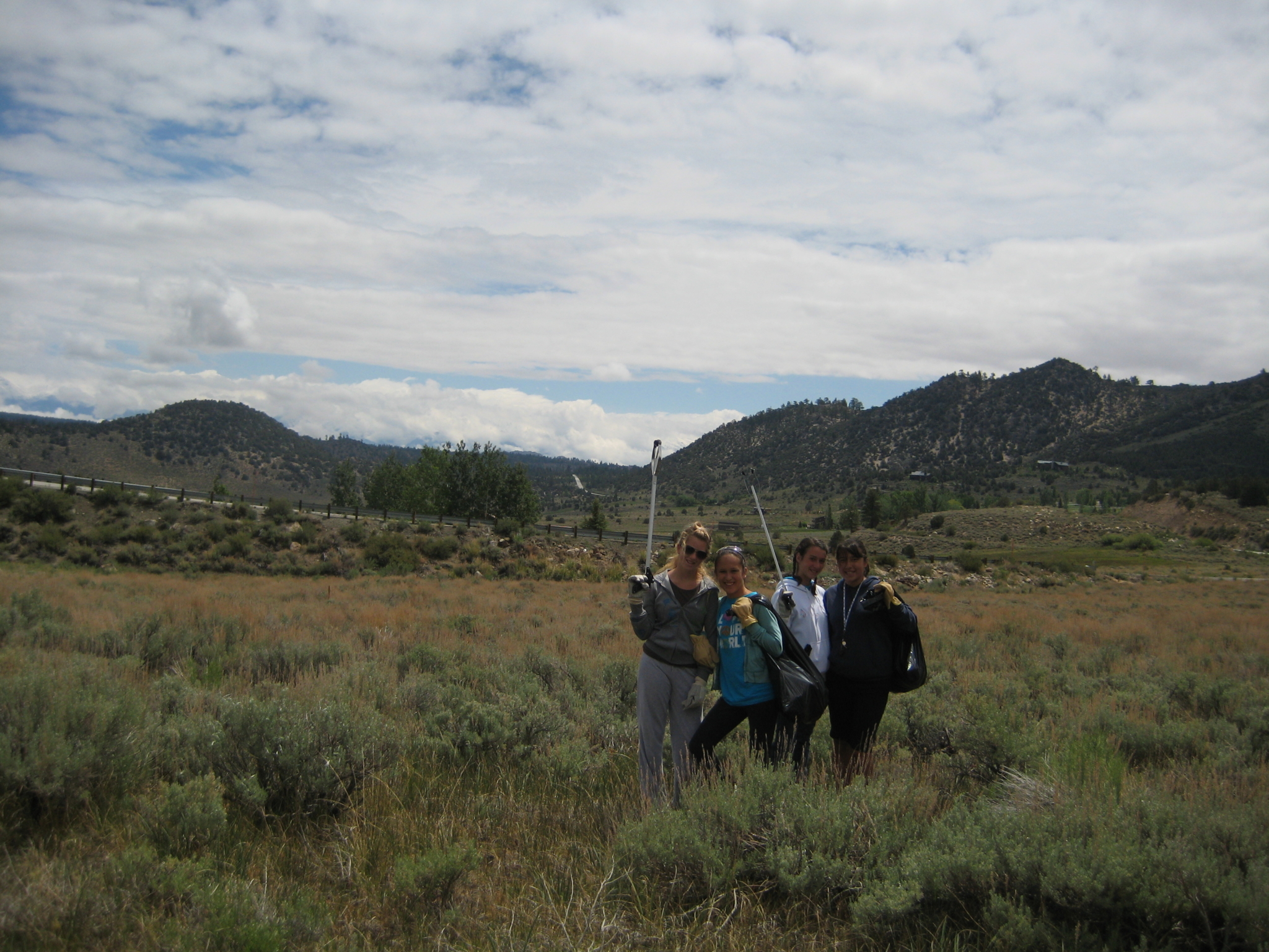 Four San Diego Girl Scouts with their bags of trash and tools Four San Diego Girl Scouts with their bags of trash and tools