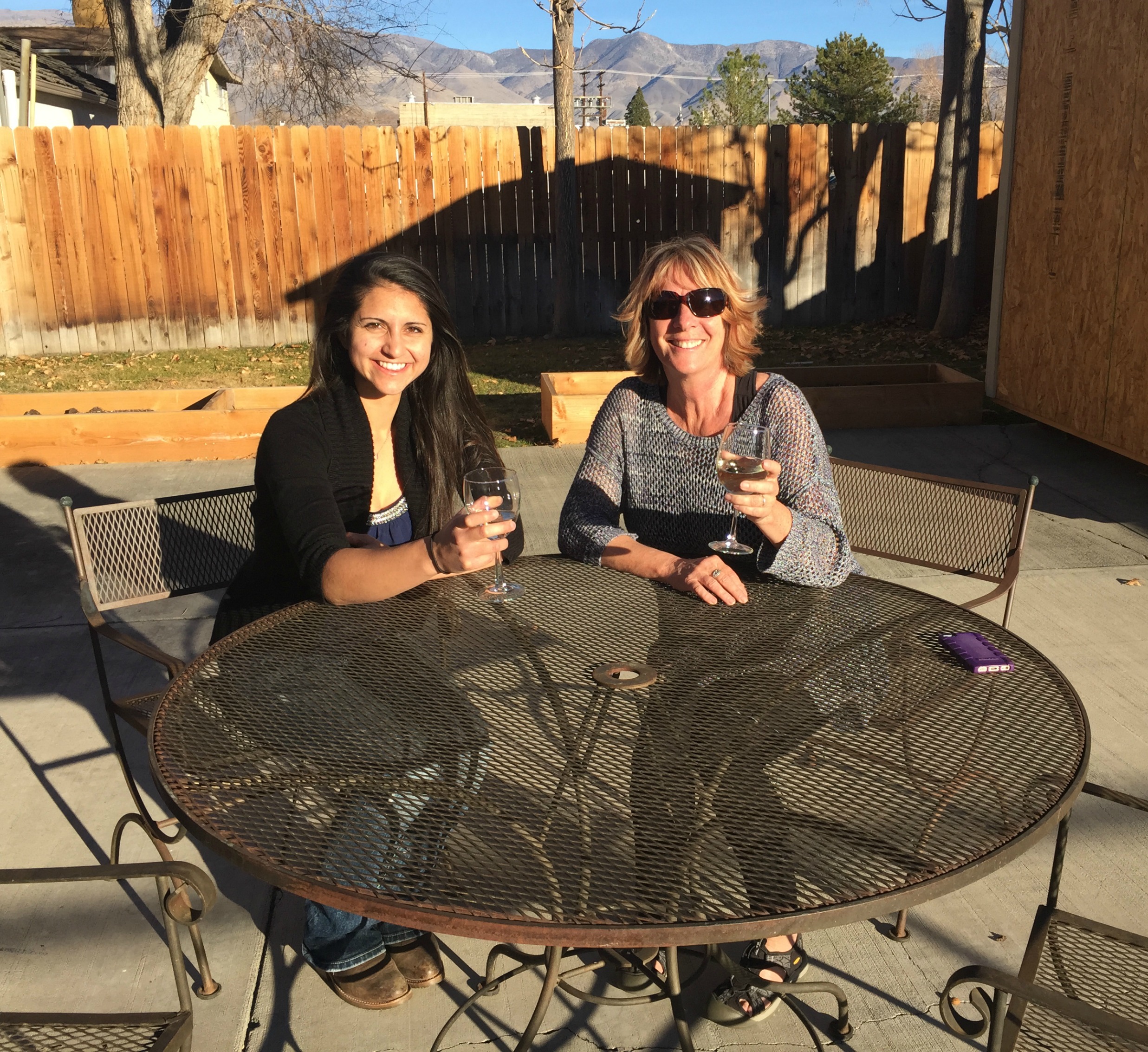 Mini and Kay enjoying a glass of wine in the backyard at the end of a long workweek!