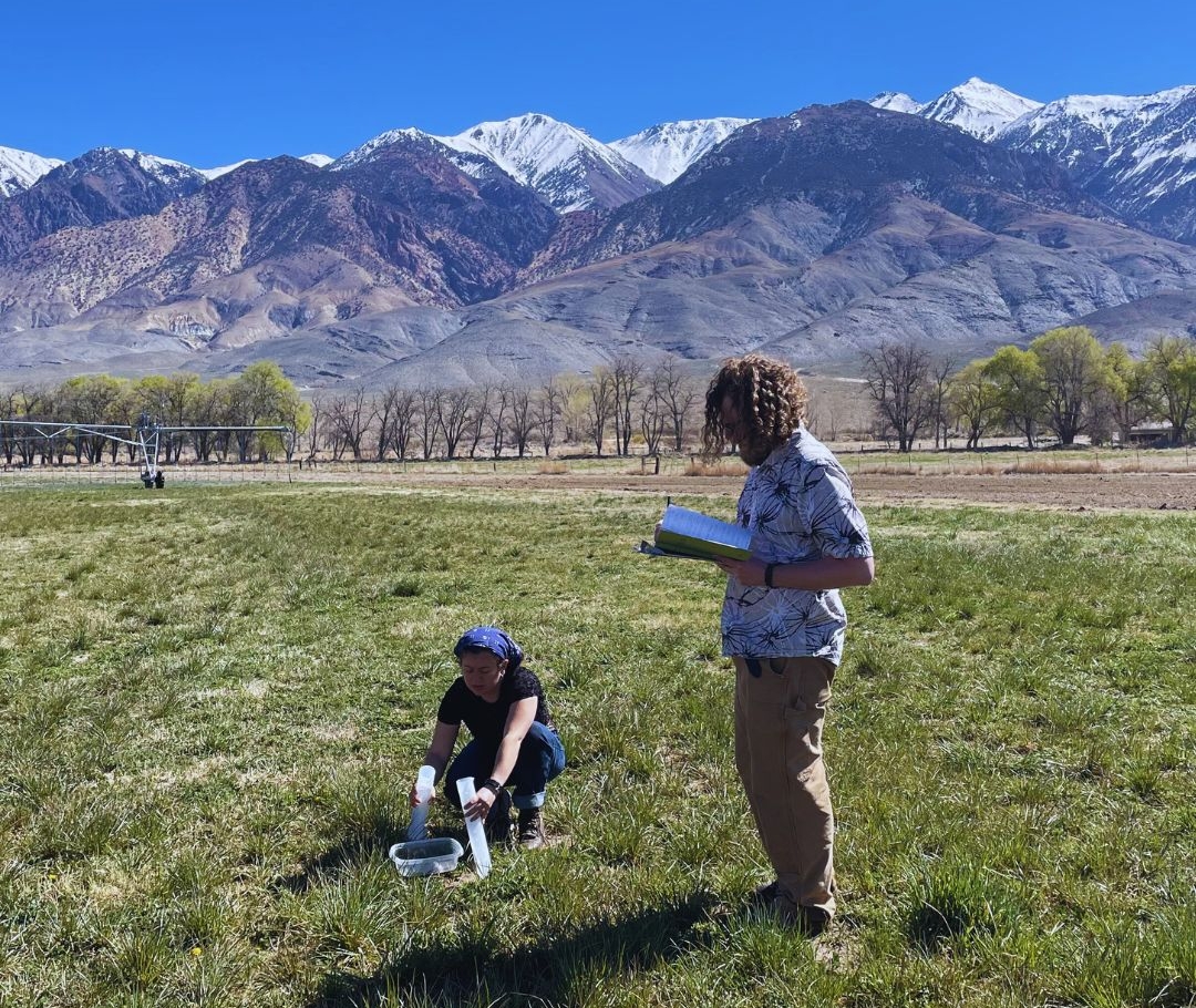 Rangeland Conservationist Ziani Paiz and Soil Conservationist Spencer Ostergaard in the field, taking soil samples.